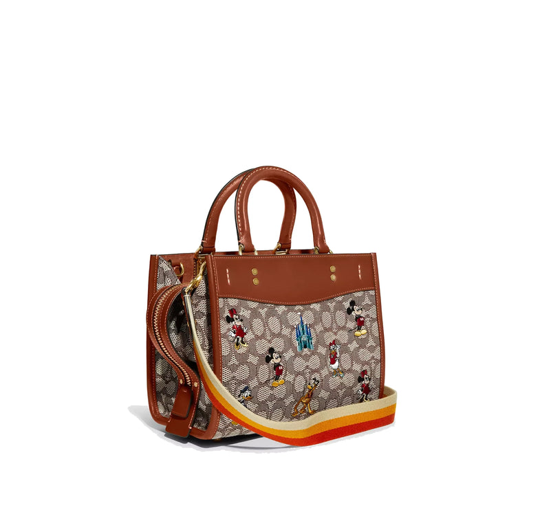 Coach Women's Disney X Coach Rogue 25 In Signature Textile Jacquard With Mickey Mouse And Friends Embroidery Brass/Cocoa Burnished Amber Multi