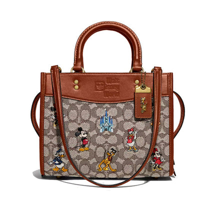 Coach Women's Disney X Coach Rogue 25 In Signature Textile Jacquard With Mickey Mouse And Friends Embroidery Brass/Cocoa Burnished Amber Multi